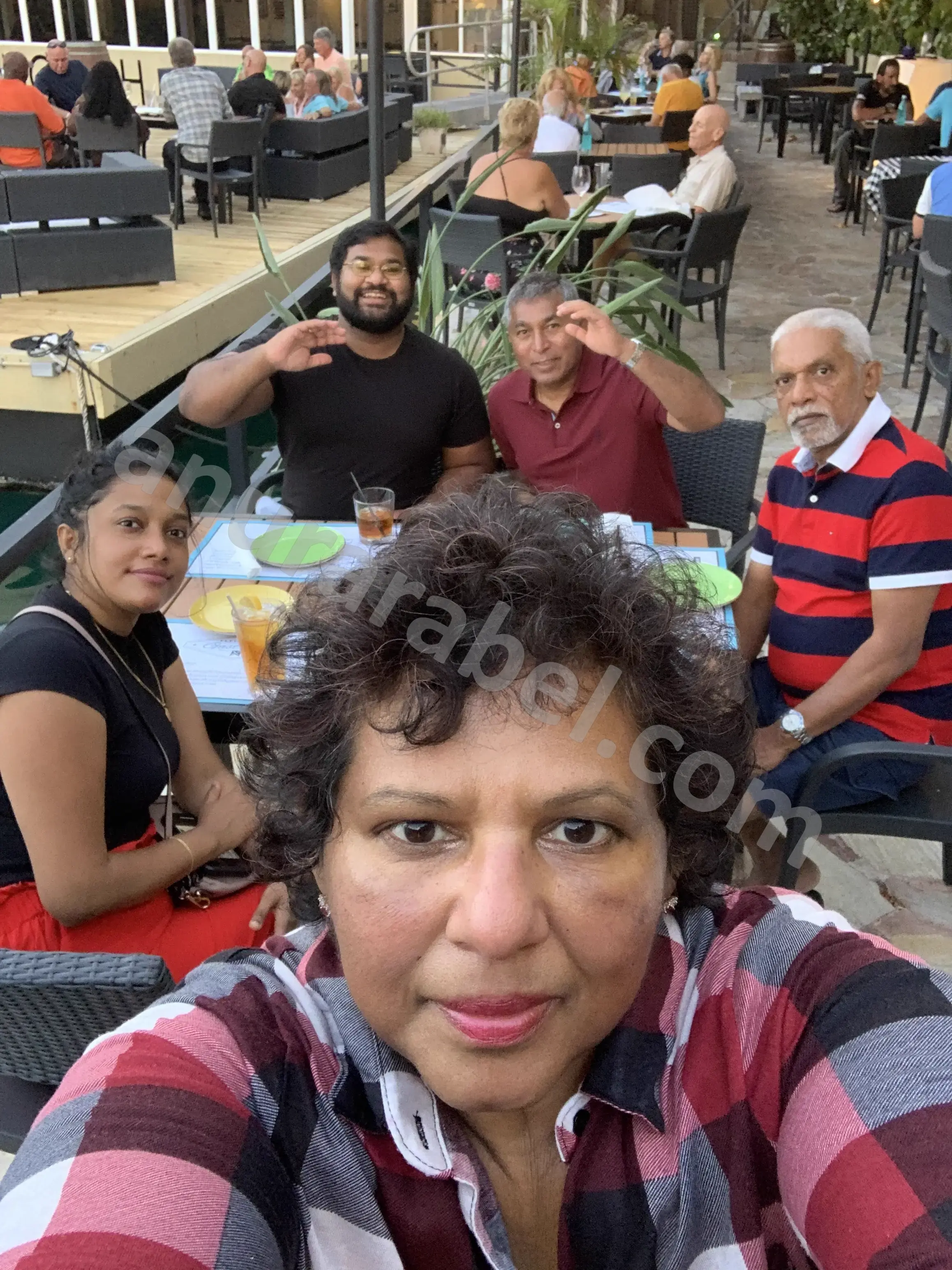 Anura with family Jayamini, Chamara, Ruwanthi, and Ruwanthi's dad at Flying Fish Gastrobar in Grand Bahama, Bahamas